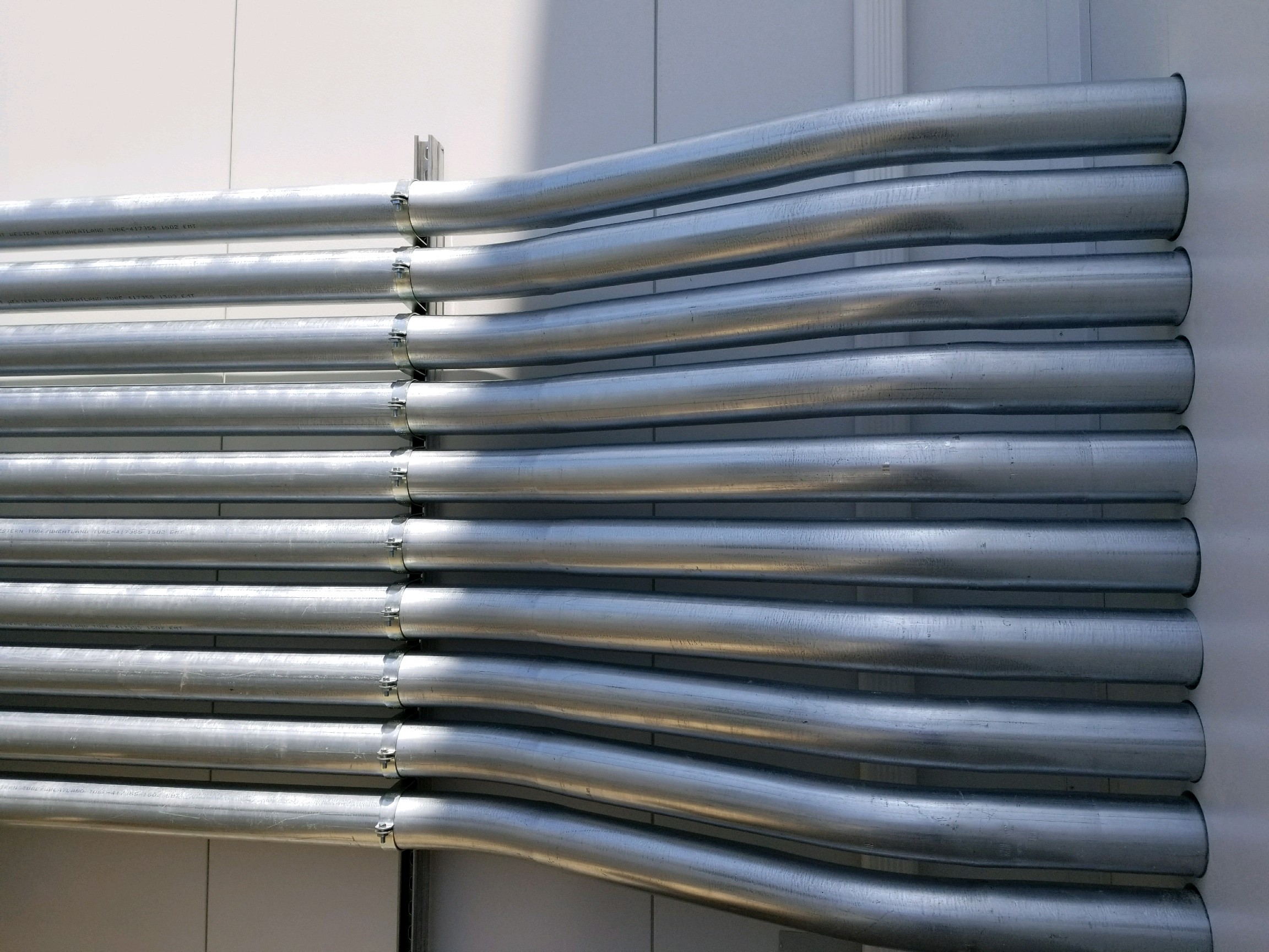 Neatly bent electrical conduits for commercial cable management and infrastructure efficiency.